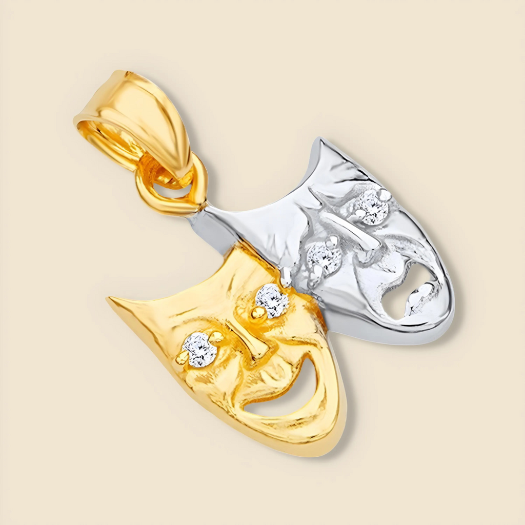 Tilted view of 14K Two-Tone Solid Gold Comedy & Tragedy Charm on plain background, highlighting sparkling cubic zirconia and two-tone gold finish.