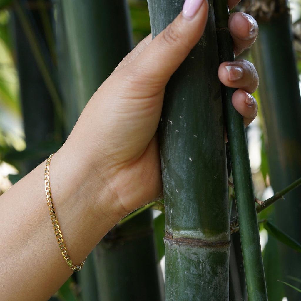 14K Real Gold 3.5mm Cuban White Pave Bracelet worn by a model, side view highlighting the thickness and pave details.