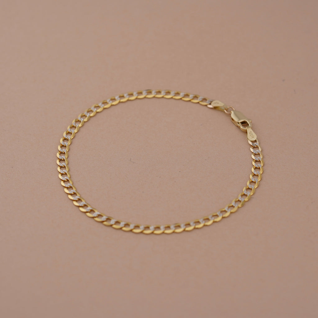 14K Real Gold 3.5mm Cuban White Pave Bracelet laid flat, highlighting the length, secure lobster clasp, and intricate pave accents.