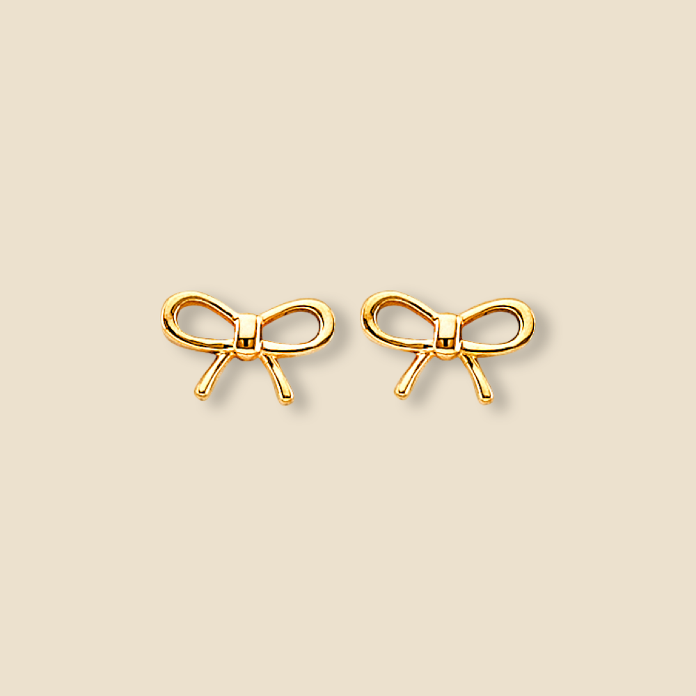 Minimalist 14K gold ribbon push back earrings shown on a plain background, highlighting their bow design and polished finish.