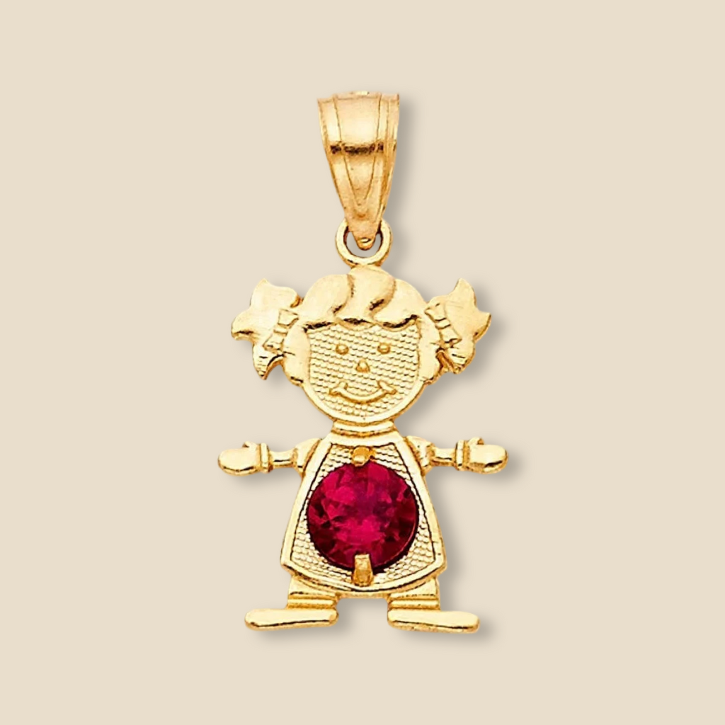14K Gold Girl Charm with red cubic zirconia birthstone, resting on a plain background to showcase its radiant shine and intricate details.