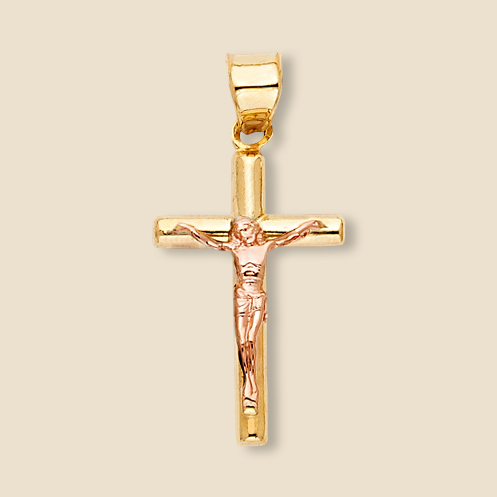 14K two-tone gold crucifix pendant displayed against a plain background, clearly showcasing the figure of Jesus on a polished cross.