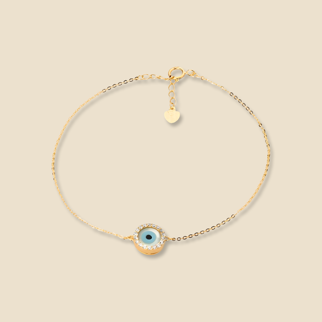 Close-up of 14K Yellow Gold Evil Eye Bracelet on a plain background, showcasing the warm gold finish and delicate evil eye centerpiece.