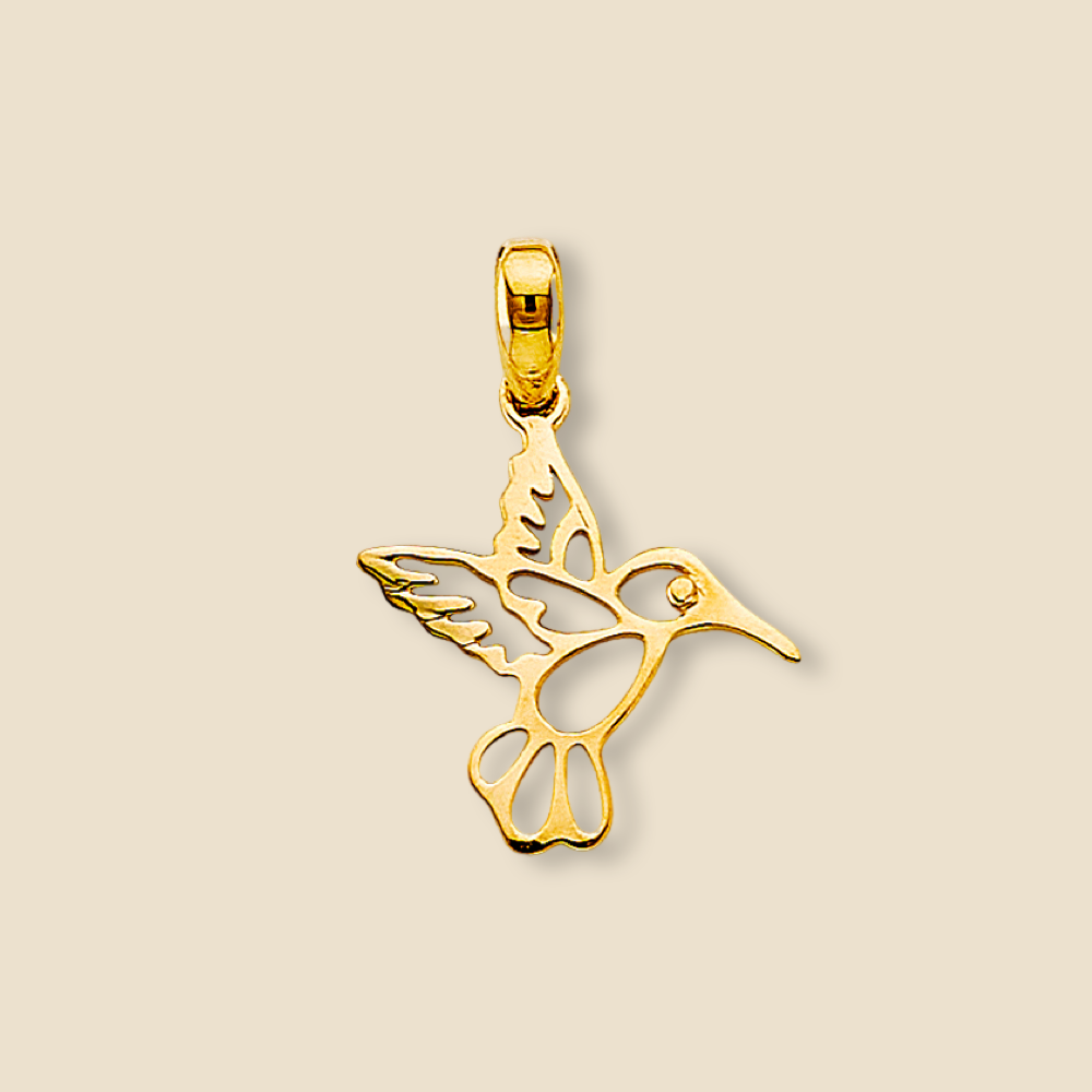 A beautifully detailed 14K Yellow Gold Hummingbird Pendant resting on a plain background, showcasing its intricate design, graceful silhouette, and polished finish.
