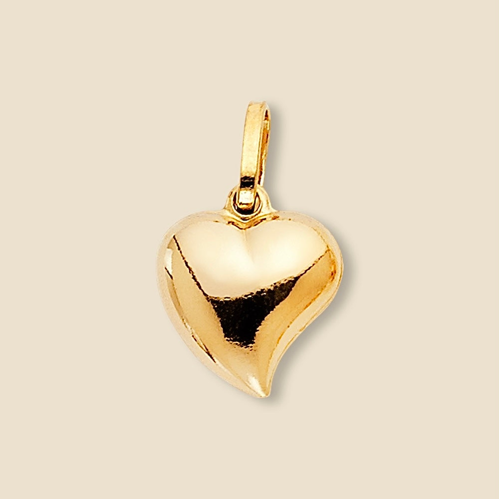 A 14K Yellow Gold Hollow Heart Pendant displayed on a plain background, showcasing its delicate open-heart design and polished gold finish.