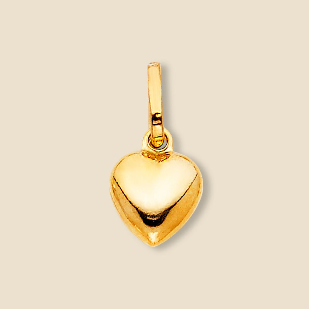 Isolated view of hollow heart gold pendant on a plain background, emphasizing the clean lines and smooth finish