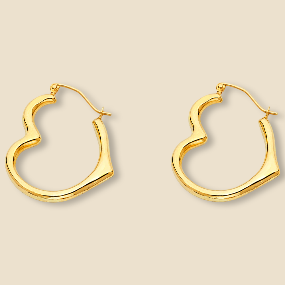 Close-up of minimalist 14K yellow gold heart-shaped hoop earrings, showcasing their polished finish and delicate design, set against a plain white background.