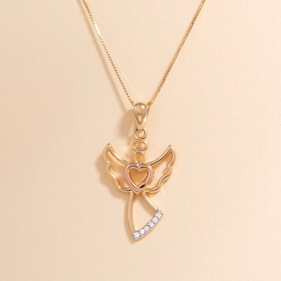 A delicate 14K yellow gold angel pendant with a polished finish, displayed against a plain background to highlight its elegant craftsmanship and divine design.