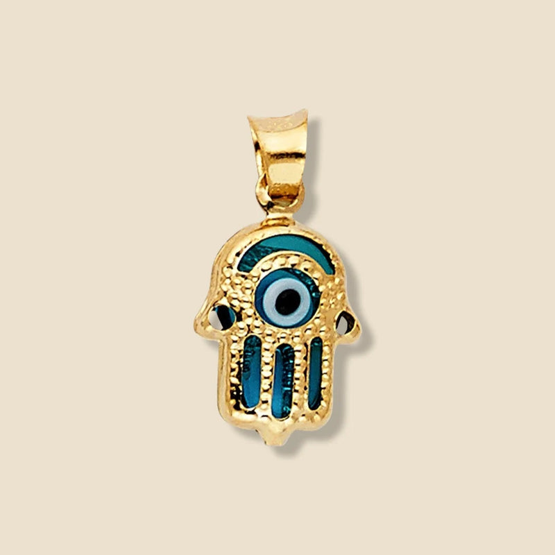 A 14K yellow gold Hamsa pendant with a striking blue Evil Eye at its center, displayed on a plain background. The polished gold and vivid blue eye create a powerful symbol of protection and style.