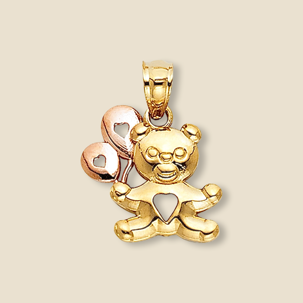 A delicate 14K solid gold pendant featuring an adorable baby bear holding a balloon. The polished finish enhances its shine, making it a timeless and whimsical jewelry piece. Displayed against a clean, plain background to highlight its fine craftsmanship and intricate details.