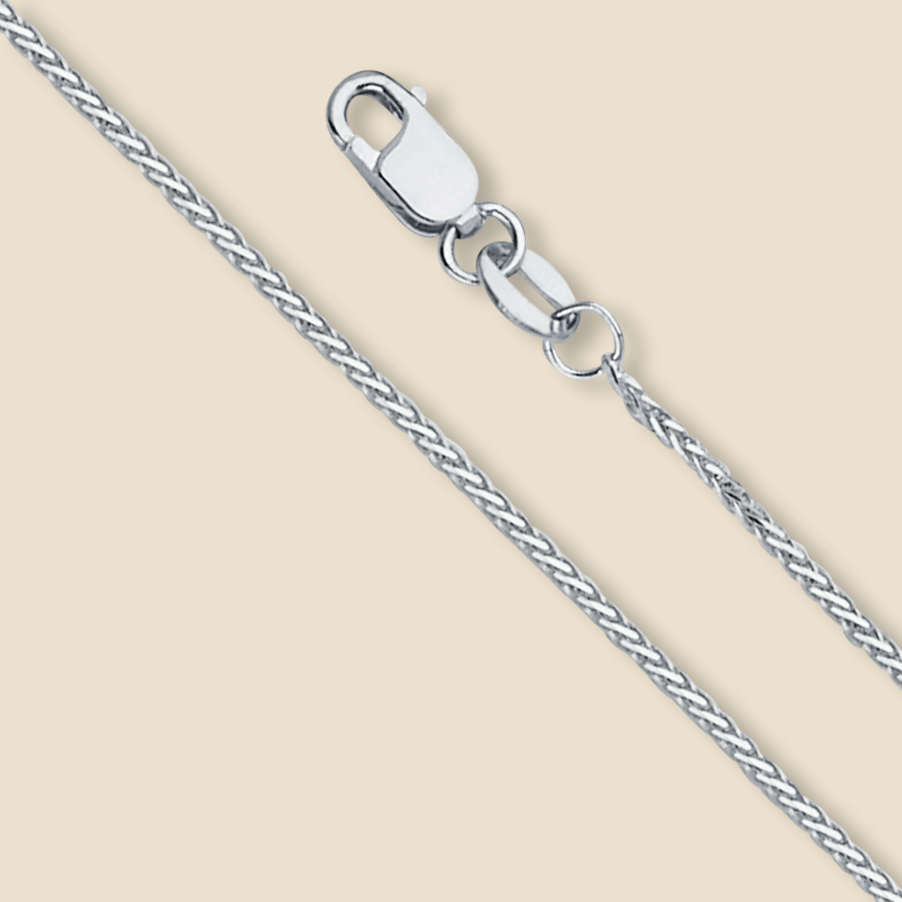 14K white gold 1mm round wheat chain necklace displayed on a plain background. Features a polished finish and diamond-cut detailing for a subtle sparkle.