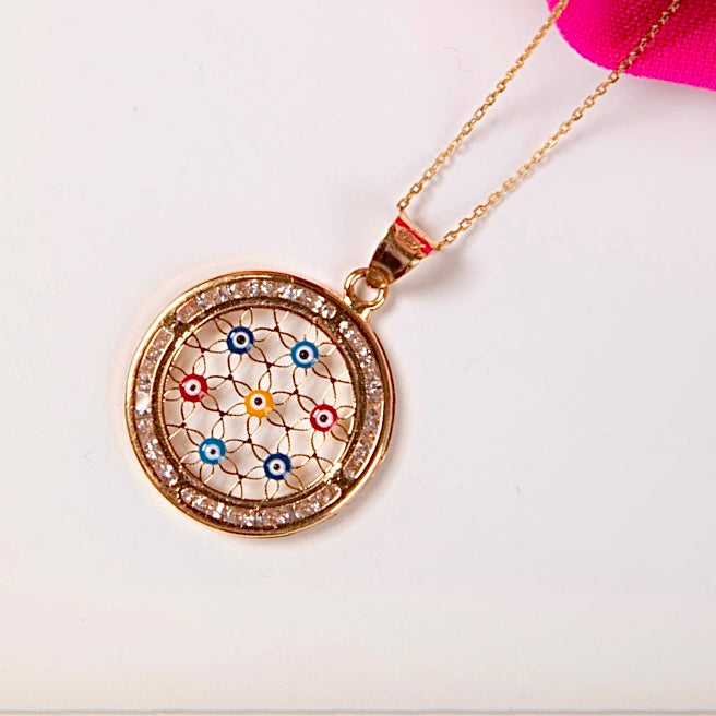 14K Yellow Gold Evil Eye Charm Pendant shown on a plain background, highlighting its polished finish and classic protective symbol.