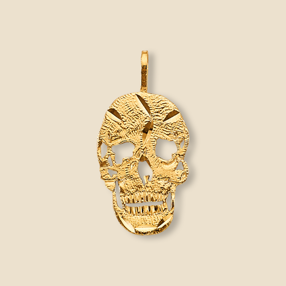 14K Solid Gold Skull Charm - High-polished, intricately designed skull pendant displayed against a plain background.