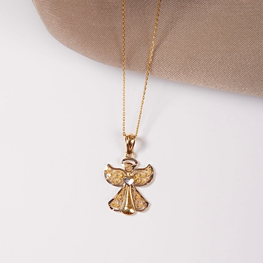 A close-up of the 14K Gold Two-Tone Angel Charm on a white backdrop, showcasing its intricate detailing and polished yellow and white gold finish.