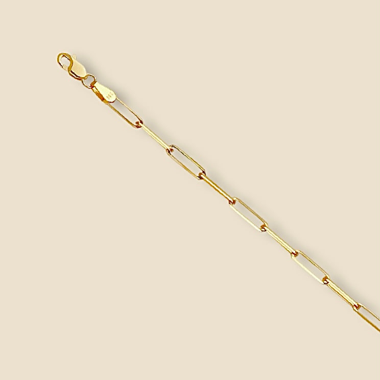14K Yellow Gold Triangle Diamond-Cut Paperclip Bracelet on a plain background, showing its shiny 2.7mm links and elegant minimalist design.