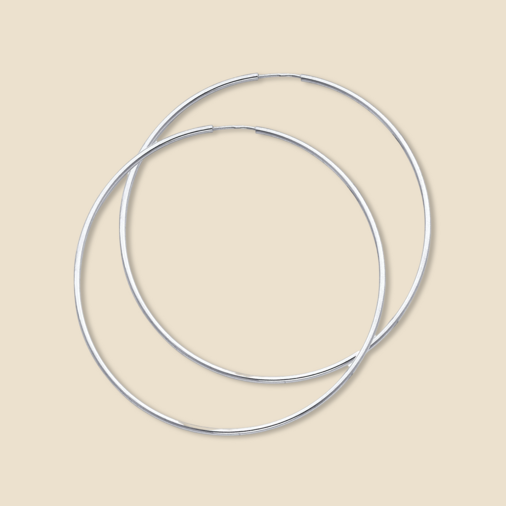 4K White Gold 1.5mm Endless Hoop Earrings (55mm) displayed against a plain background, showcasing their polished and lightweight design.