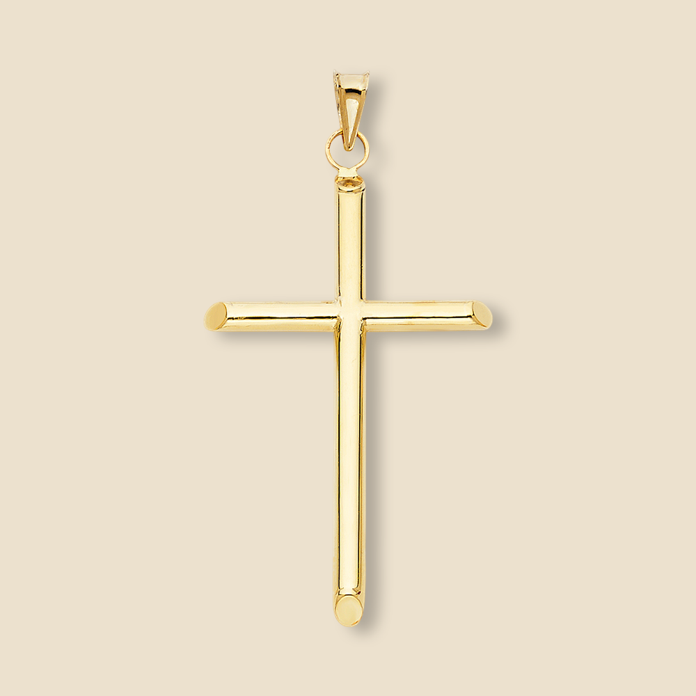 A large 14K yellow gold cross pendant photographed against a plain background to emphasize its gleaming surface and substantial size.