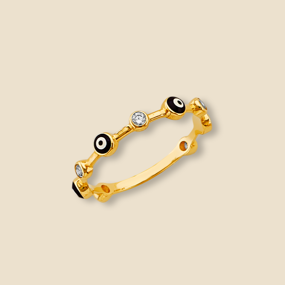 A minimalist 14K gold evil eye ring with blue CZ stone, centered on a plain background to highlight its polished gold band and symbolic design.