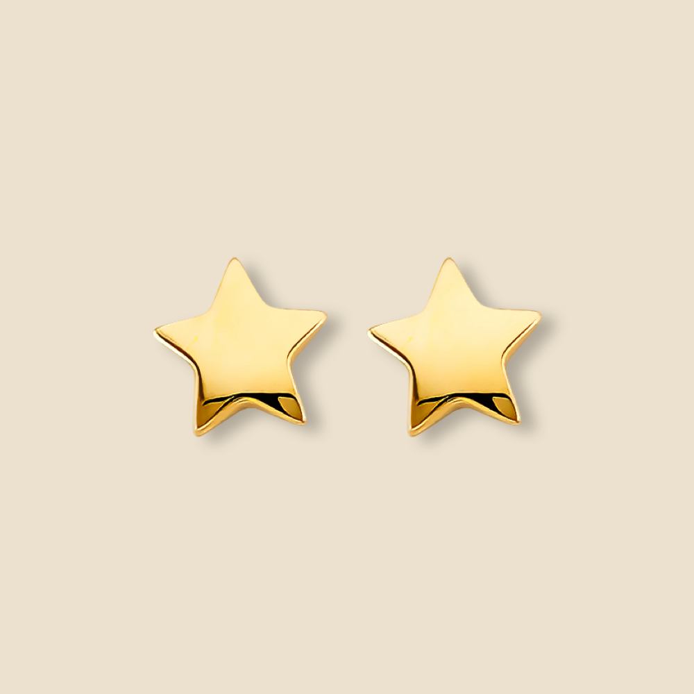 Minimalist 14K gold star stud earrings photographed on a plain background, showing clean lines and shine.