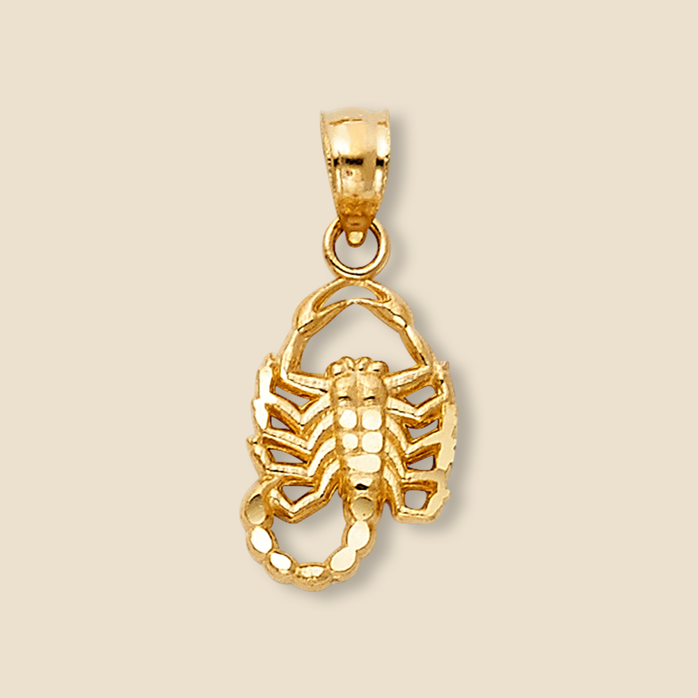 A 14K real gold scorpion pendant displayed against a plain background, highlighting its polished finish, intricate detailing, and dainty size.