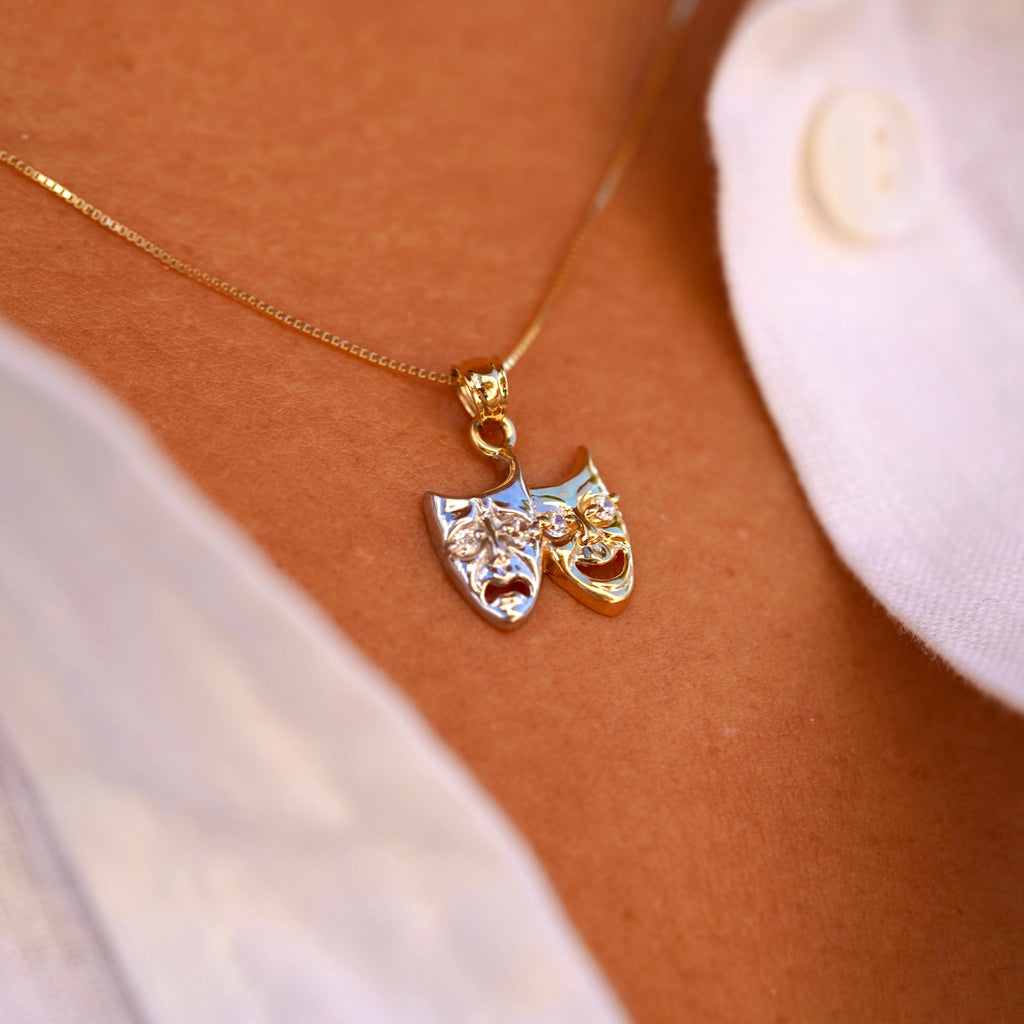 Model wearing 14K Two-Tone Solid Gold Comedy & Tragedy Charm from the right angle, highlighting cubic zirconia accents and two-tone gold design.