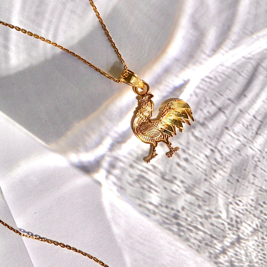 14K Solid Gold Rooster Pendant on a plain background, showcasing polished finish and fine craftsmanship.