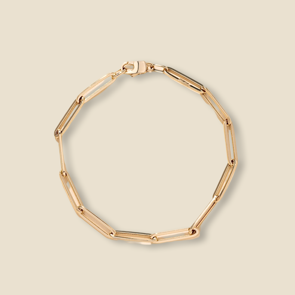 14K Yellow Gold Triangle Diamond-Cut Paperclip Bracelet on a plain background, showing its shiny 2.7mm links and elegant minimalist design.