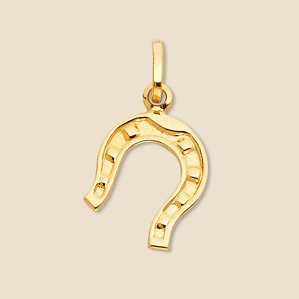 14K Solid Gold Horseshoe Charm with a polished finish, symbolizing good luck and protection, placed against a plain background.