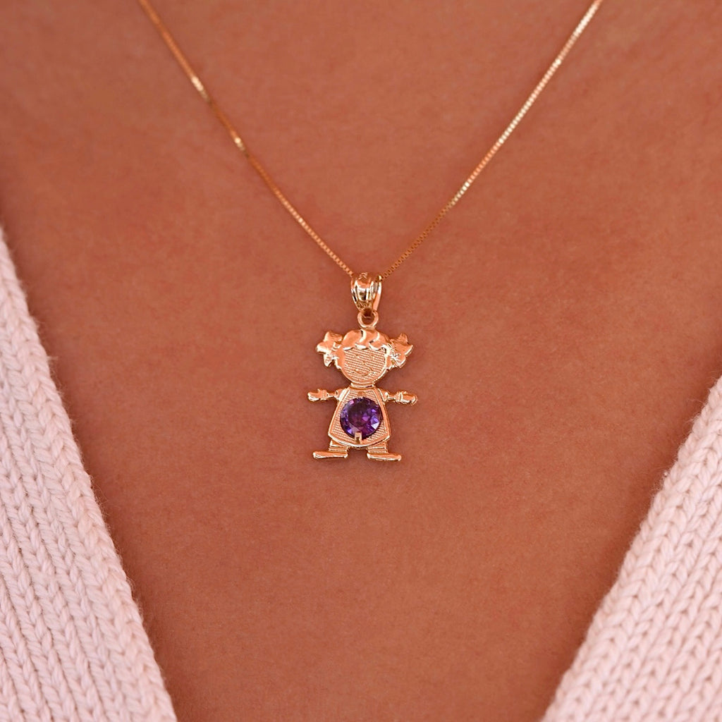 Woman wearing 14K solid gold girl charm with February light purple birthstone pendant on a necklace chain.