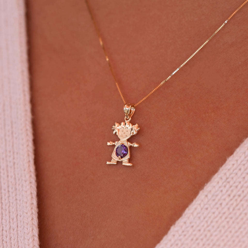 Woman wearing 14K solid gold girl charm with February light purple birthstone pendant on a necklace chain.