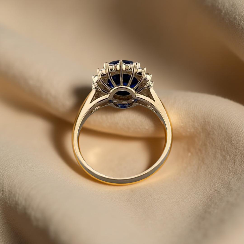 Back view of a 14K gold blue CZ engagement ring, highlighting the under-gallery and base of the setting with a clean, curved finish.