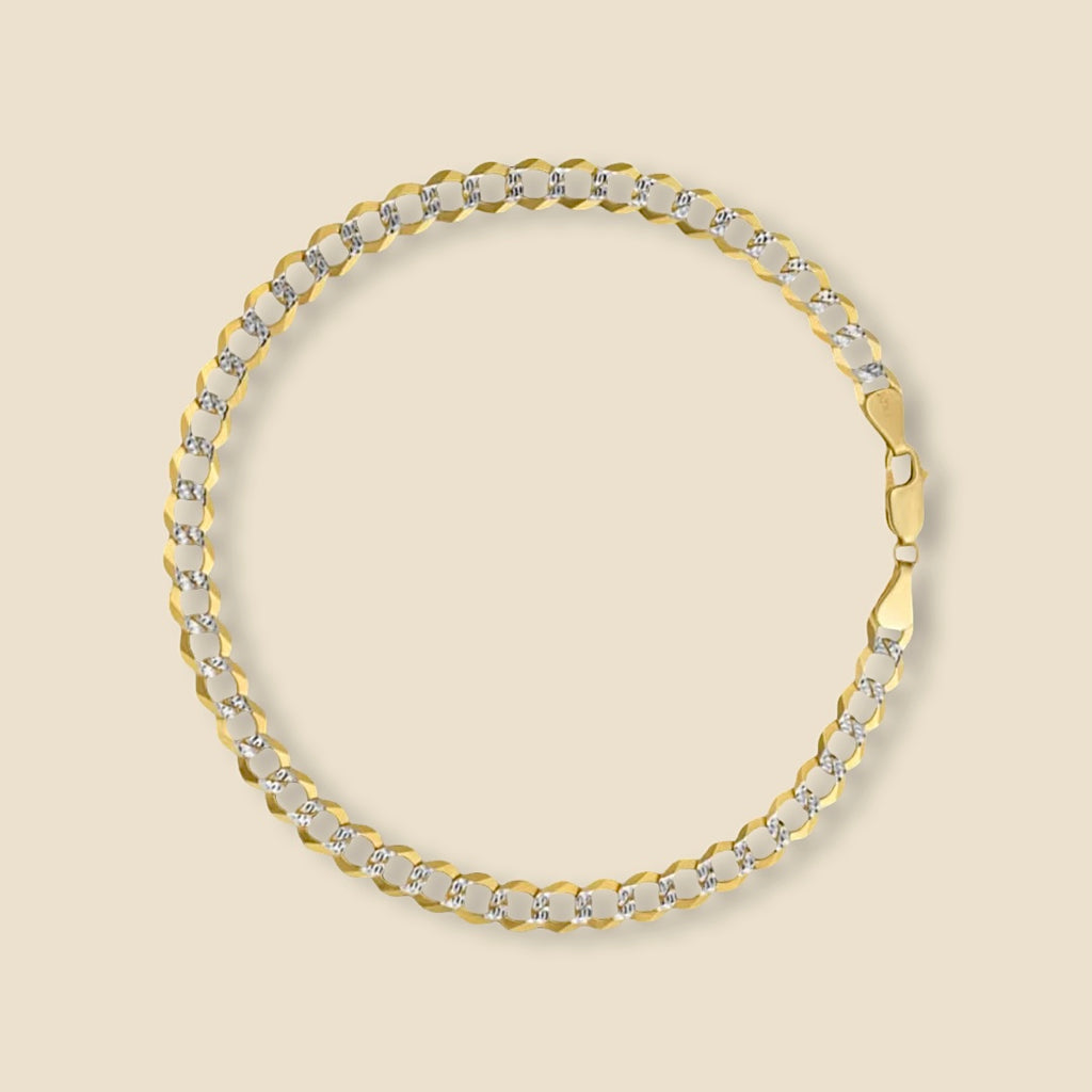 Close-up of a 14K Gold Cuban Link Bracelet with white pave design, 7 inch length, on a plain background.