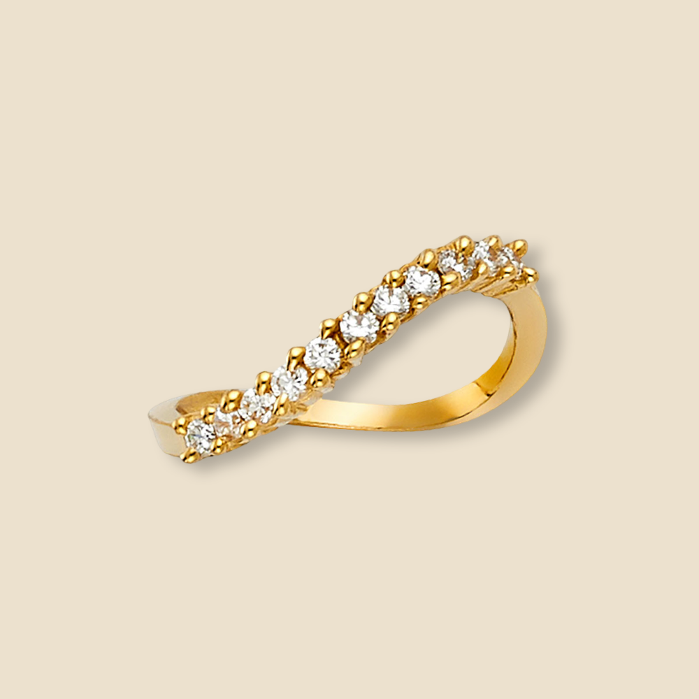 Minimalist 14K yellow gold wedding ring with CZ stones photographed on a plain background to showcase clean lines and shine.