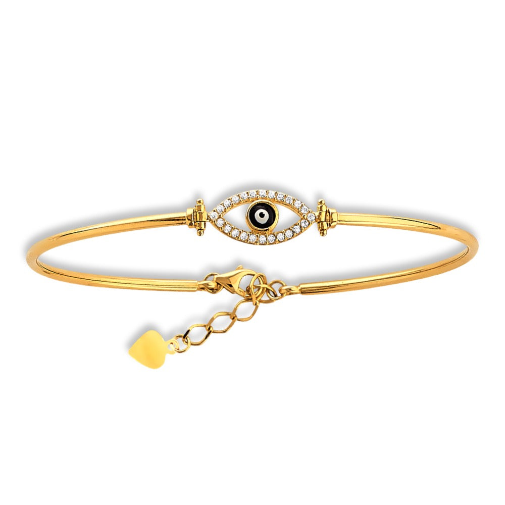 Dainty evil eye gold bangle resting on a white background, catching light across its sleek oval form—crafted in real 14K gold and designed for everyday elegance.