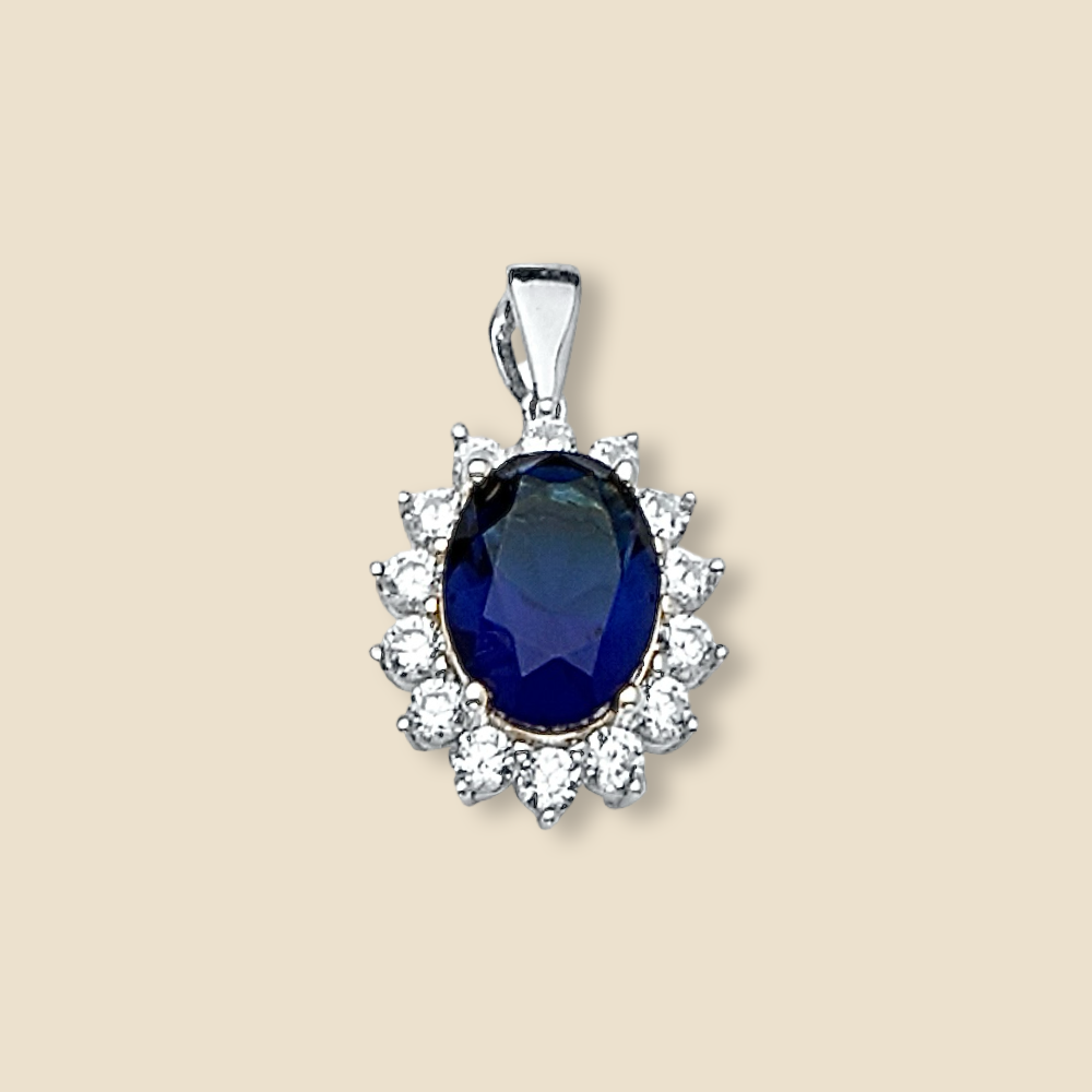 14K White Gold Pendant with Blue CZ displayed on a plain background, showing its brilliant finish and detailed craftsmanship.