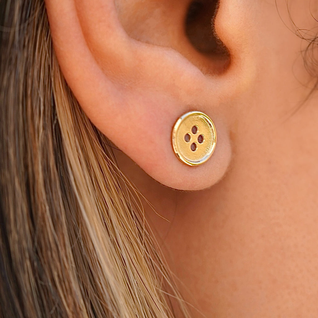 Model wearing 14K Yellow Gold Button Stud Earrings, showcasing the classic round shape and polished shine perfect for everyday wear.