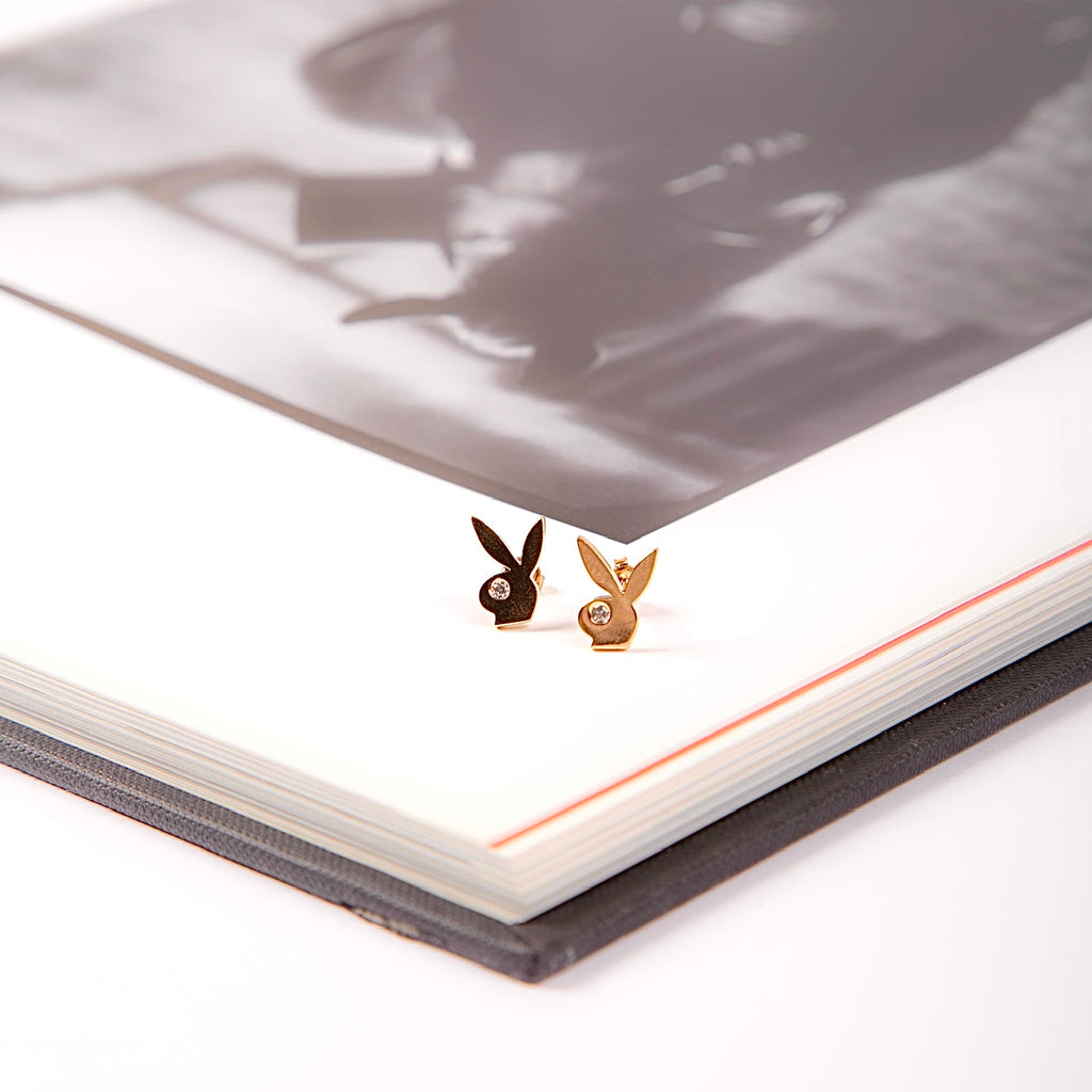 A pair of 14K gold rabbit stud earrings displayed on a plain white background, showcasing their polished finish and intricate design.