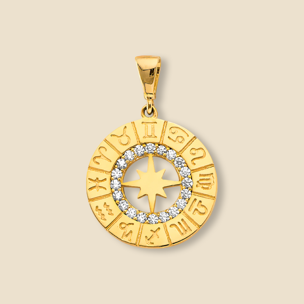 Minimalist product image of a two-tone 14K gold zodiac charm pendant with cubic zirconia against a plain background.