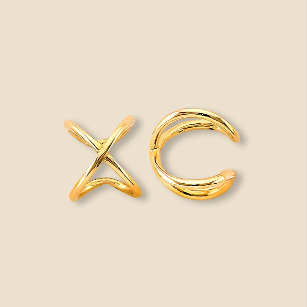 Solid 14K gold X ear cuff shown on a plain background, revealing its modern and minimalist form.