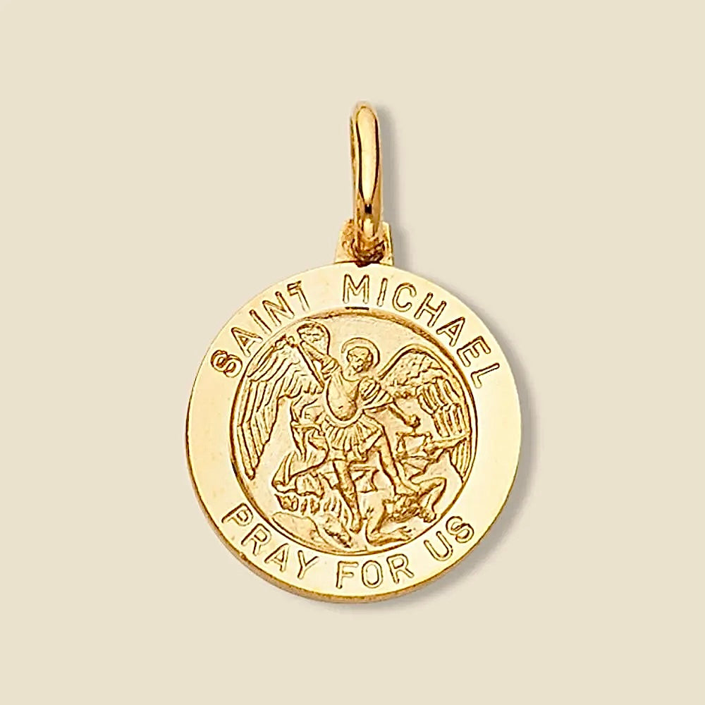 A 14K Yellow gold Saint Michael medallion pendant with a polished finish, showcasing the intricate engraving of Saint Michael the Archangel, photographed against a plain white background to highlight its refined details and craftsmanship.