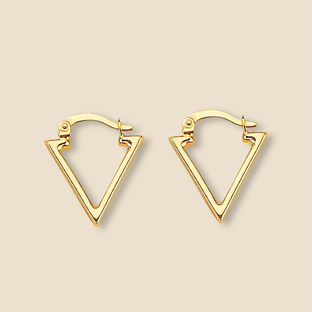 A pair of 14K Yellow Gold Triangle Hoop Earrings resting elegantly on a plain surface, showcasing their geometric shape, delicate craftsmanship, and polished finish.