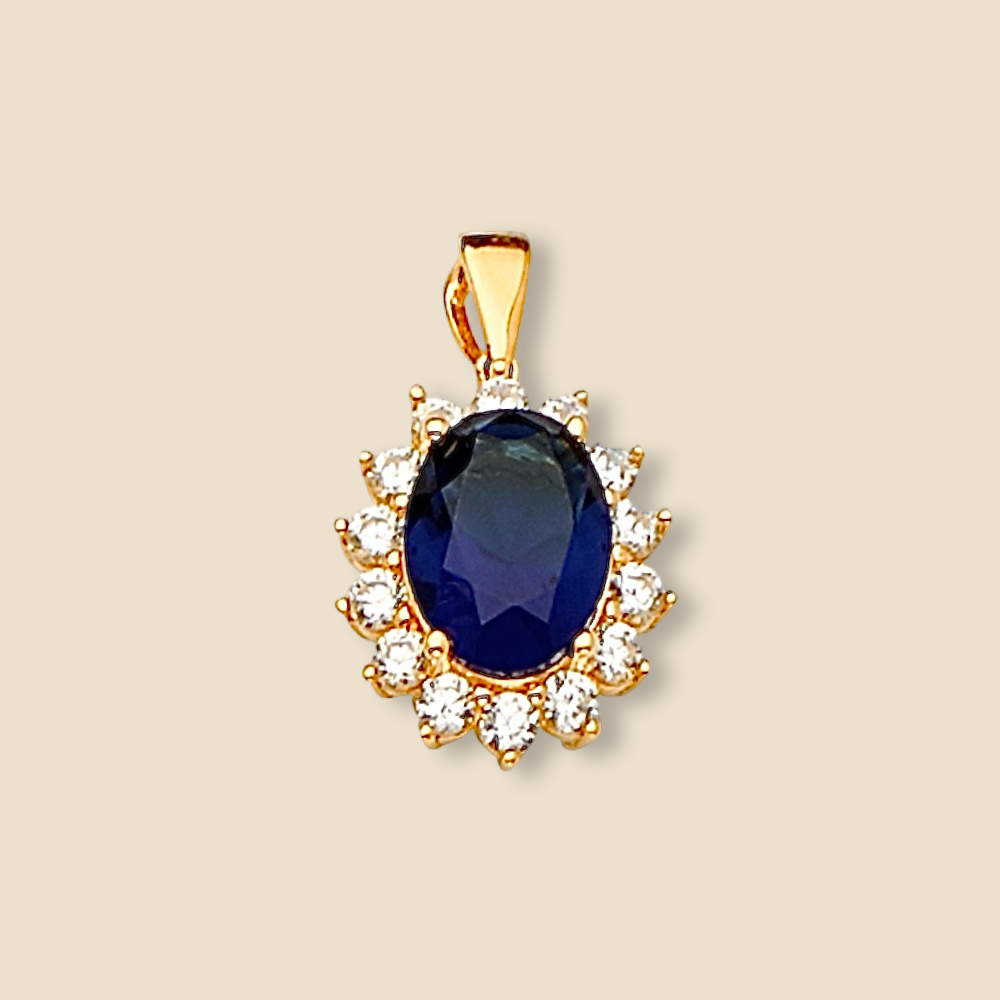 14K Yellow Gold Pendant with Blue CZ displayed on a plain background, showing its brilliant finish and detailed craftsmanship.