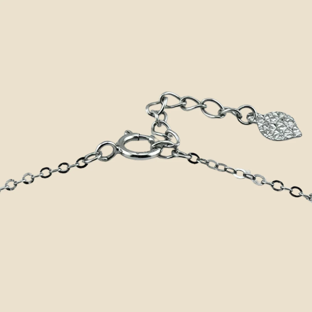 Close-up of the 14K White Gold Evil Eye Bracelet’s spring ring clasp and extender chain, showing its secure closure and adjustable length from 7 to 8 inches for a perfect fit.