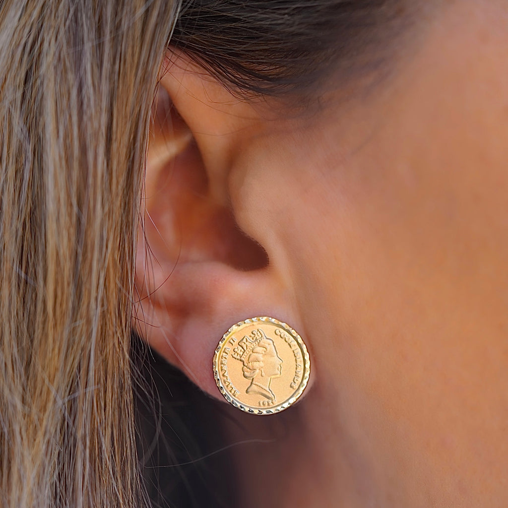 Model wearing 14K gold Queen Elizabeth coin earrings, showing their refined size and elegant sparkle for everyday or formal wear.