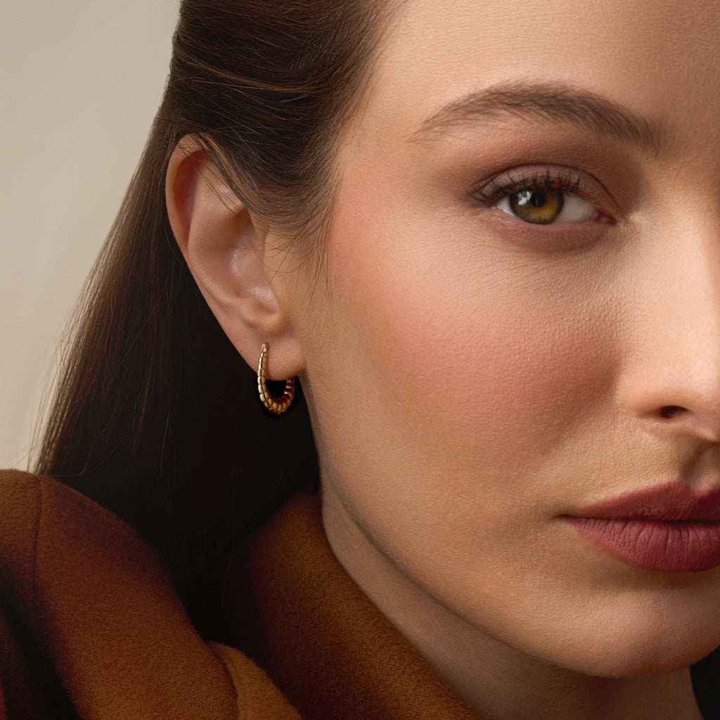 Model wearing 14K Yellow Gold Fancy Hollow Hoop Earrings, showing their elegant shine and comfortable lightweight design.
