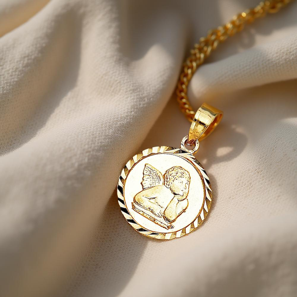 Elegant 14K Gold Angel Charm Pendant resting on a soft, off-white linen cloth, showcasing its intricate design and warm golden glow in natural light.