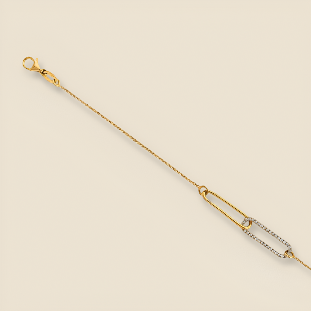14K gold paperclip bracelet displayed on a plain background with polished links reflecting light.