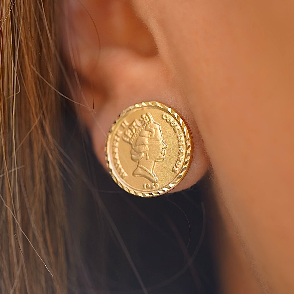 Model wearing 14K gold Queen Elizabeth coin earrings, showing their refined size and elegant sparkle for everyday or formal wear.