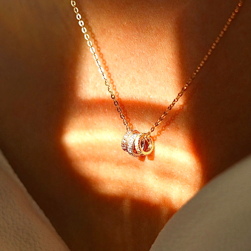 Model wearing the 14K Solid Gold Circles Necklace, showcasing its delicate design and perfect for layering.