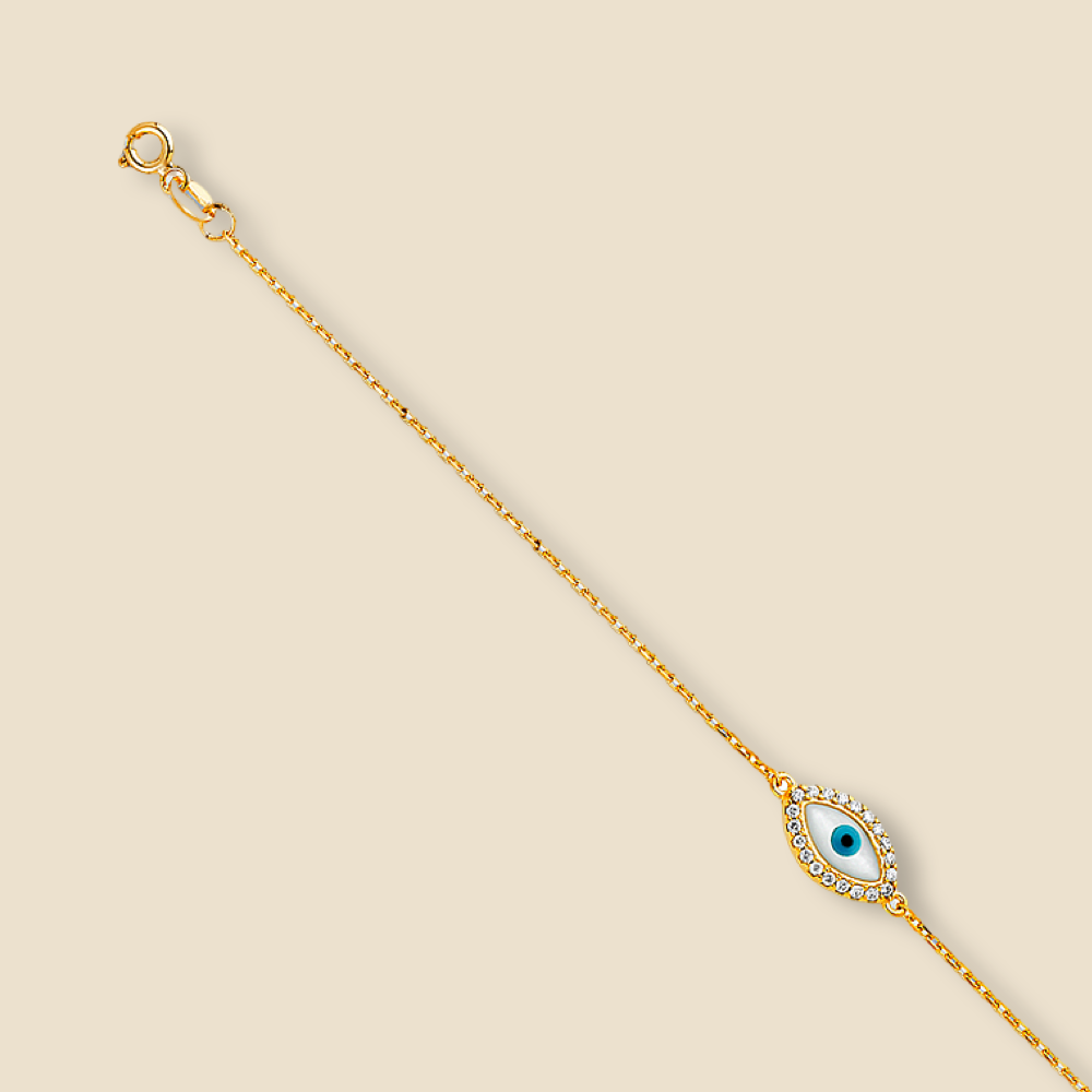 A 14K Yellow gold evil eye bracelet displayed against a plain background, showcasing its delicate chain, high-polish finish, and intricately designed evil eye charm.